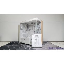 White PC case with wooden accents, showcasing internal components and an installation guide.