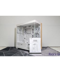 White PC case with wooden accents, showcasing internal components and an installation guide.