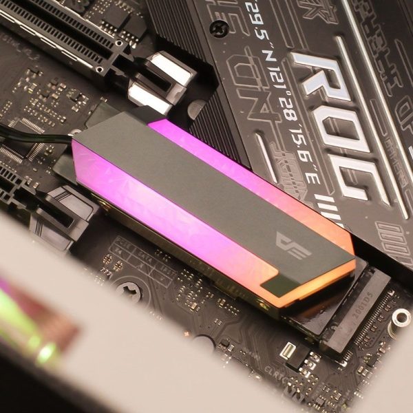 RGB SSD mounted on a motherboard, showcasing a sleek design with vibrant lighting effects.